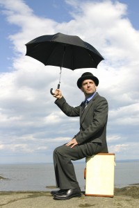 Man sitting under an umbrella